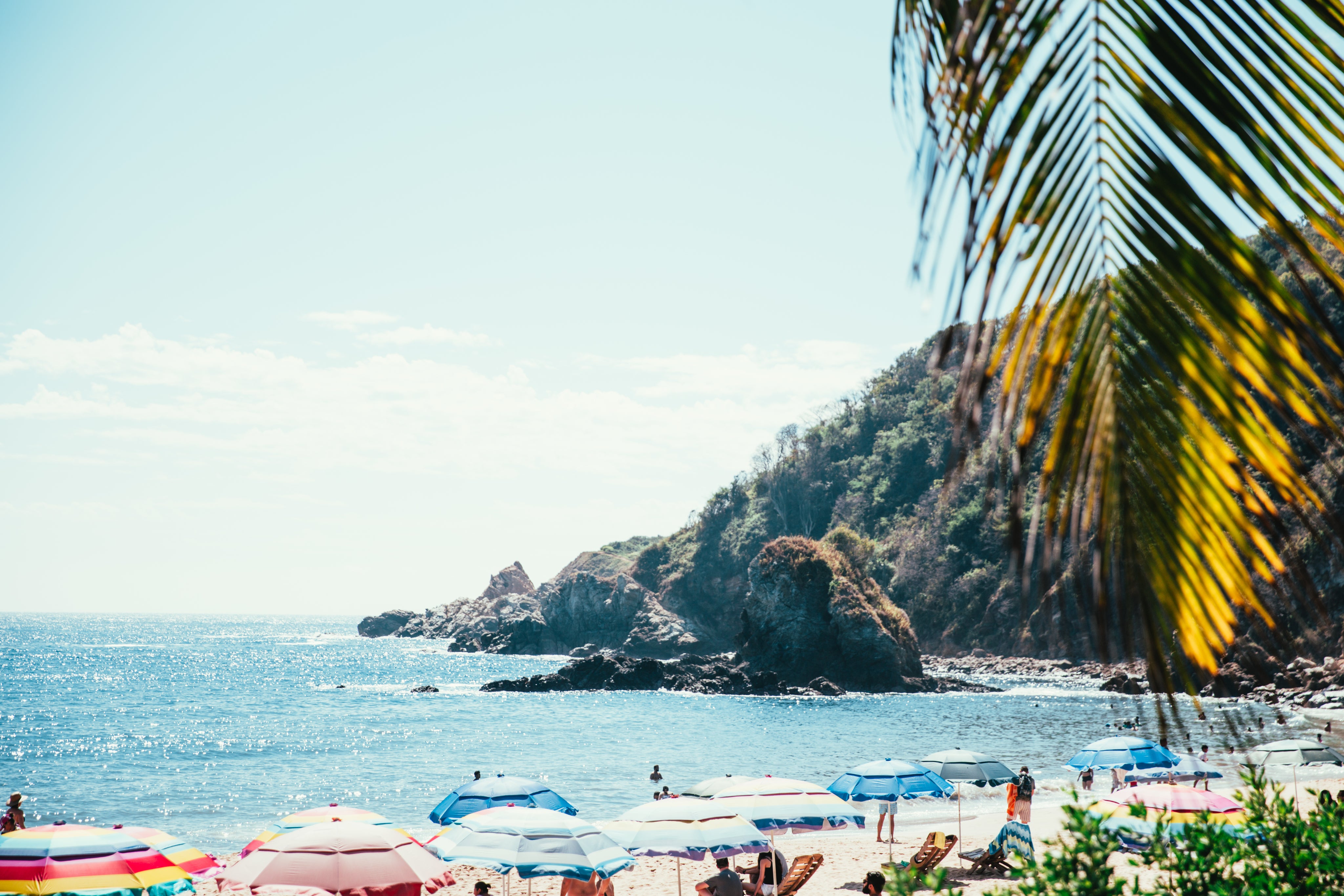 tropical-beach-below-cliff